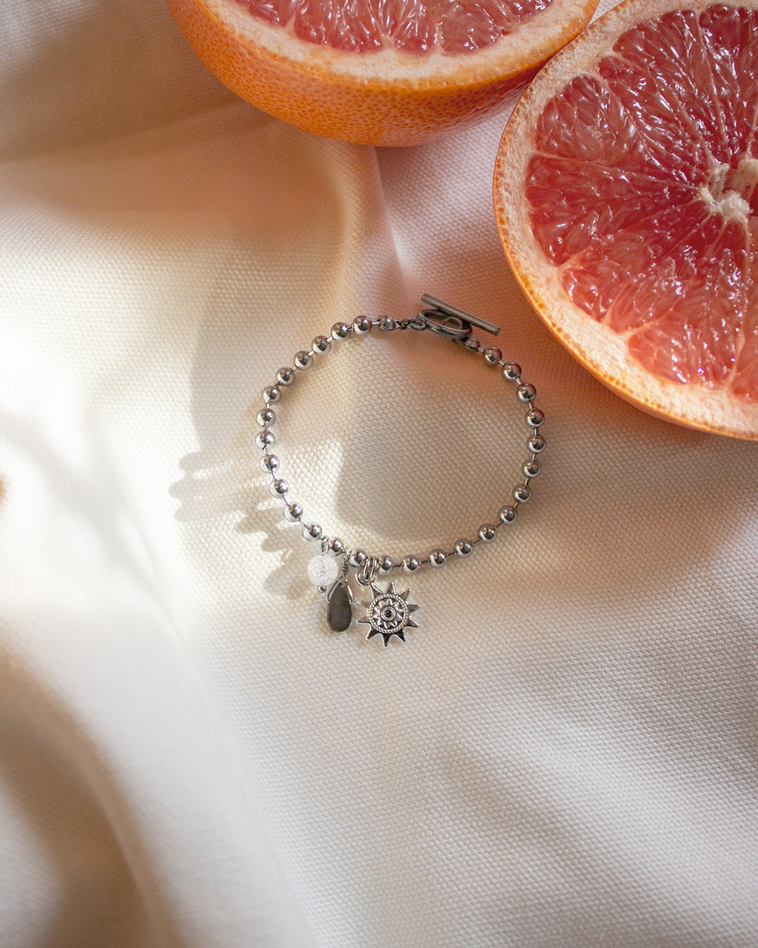 Silver Charm Bracelet with Sun Medallion and Mother of Pearl